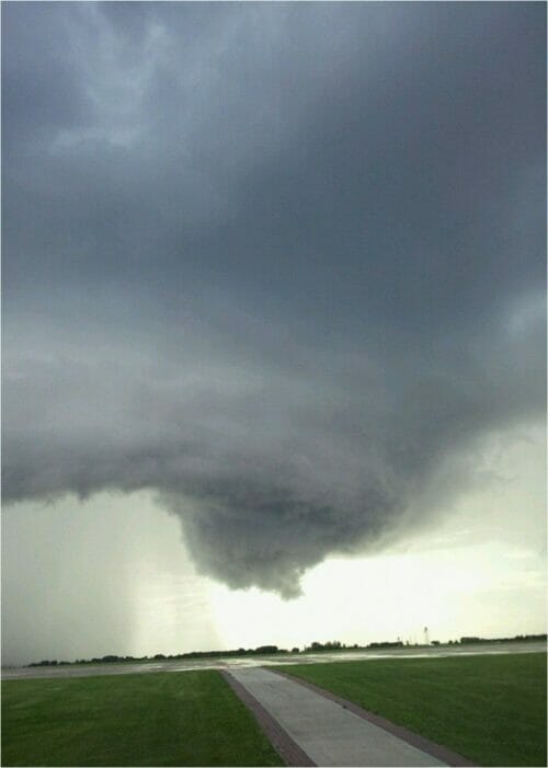 Large storm cloud gathers over the plains threatening a tornado.